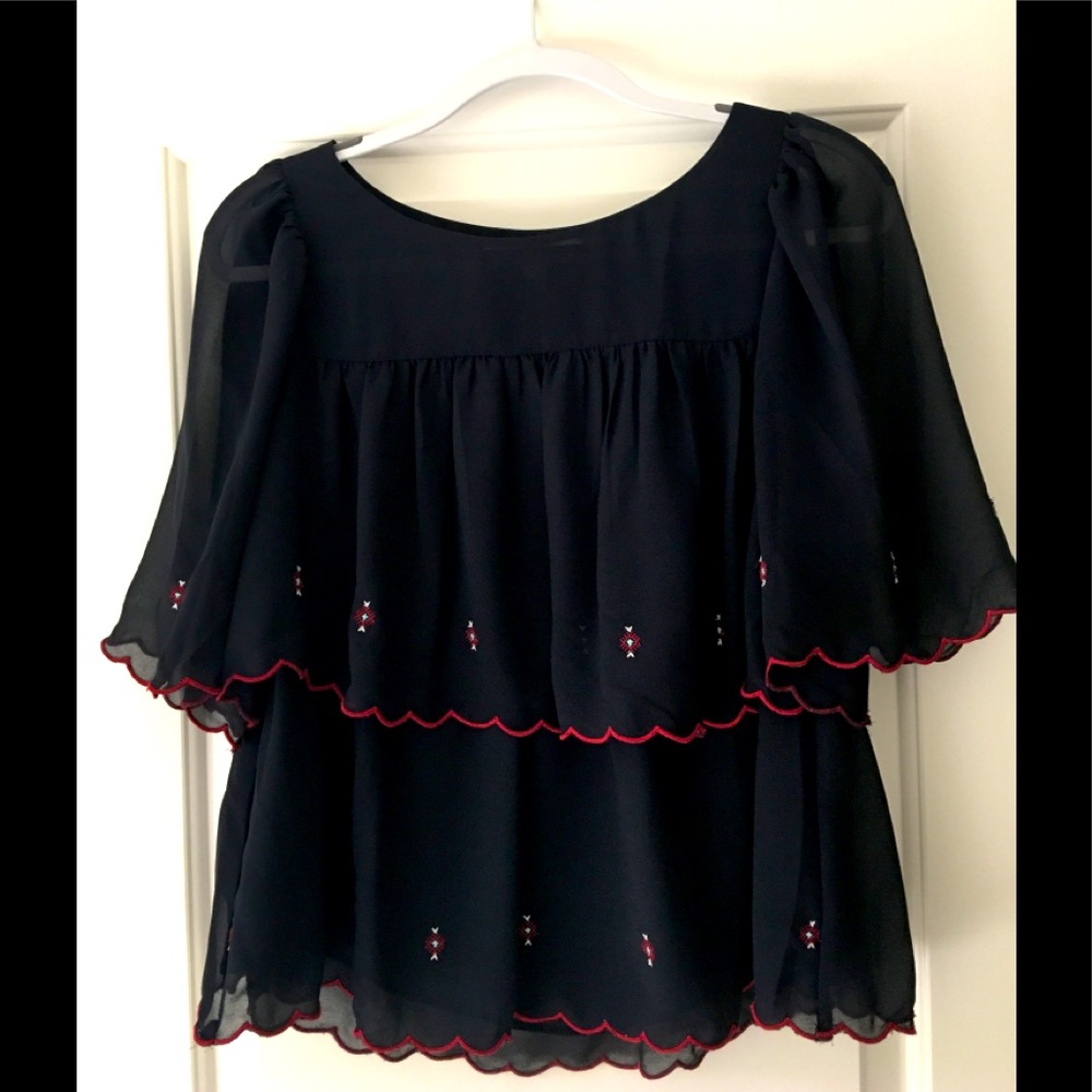 Great condition Loft navy tiered blouse with scalloped sleeves. Size XXS